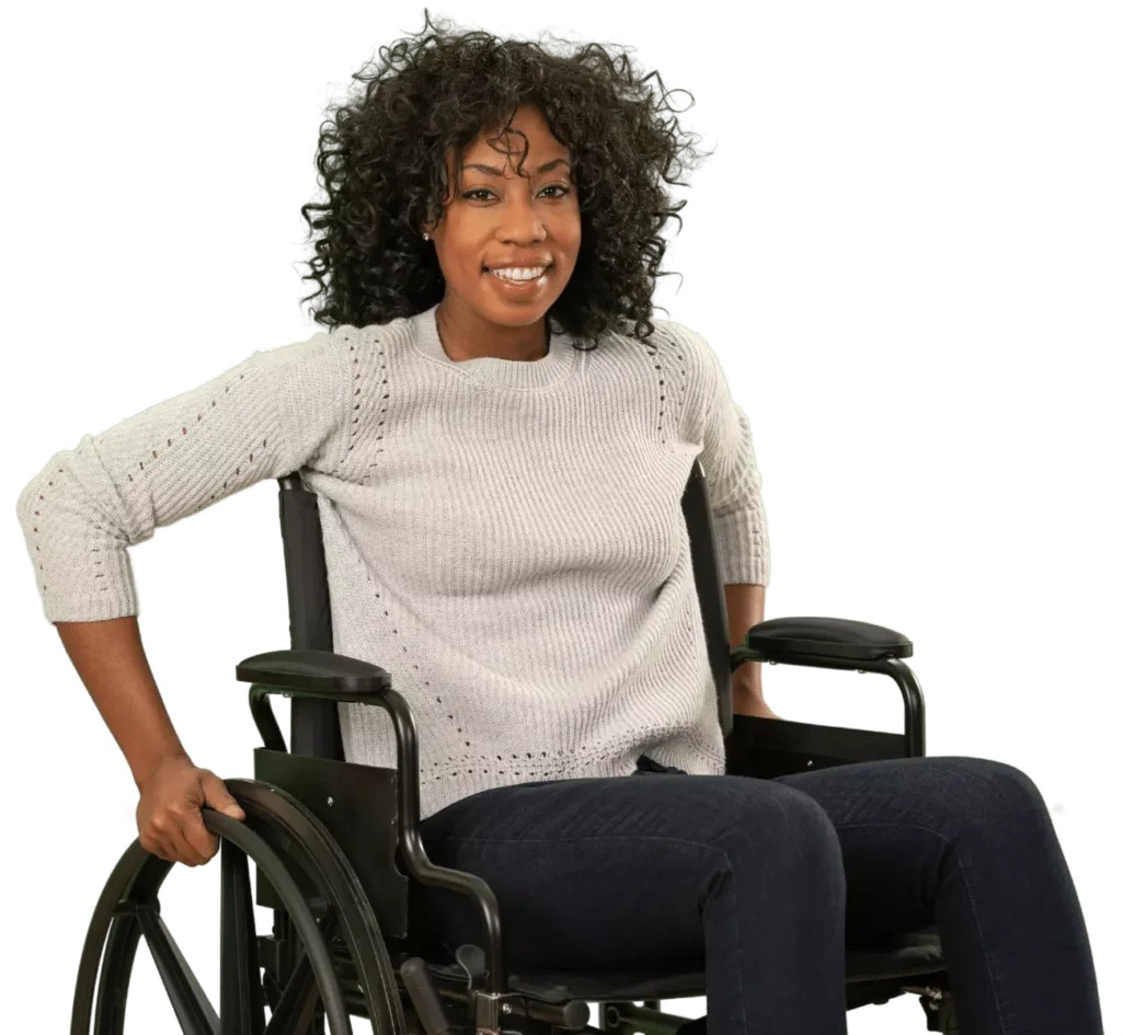 Disabled woman in wheelchair smiling at camera
