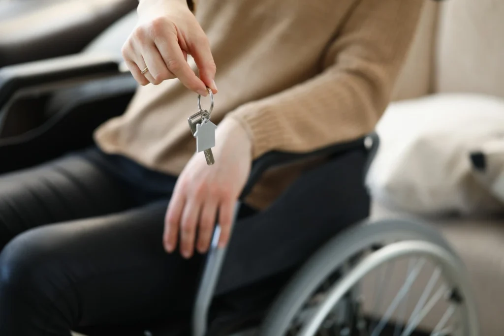 Focused view on keys being held by woman in wheelchair